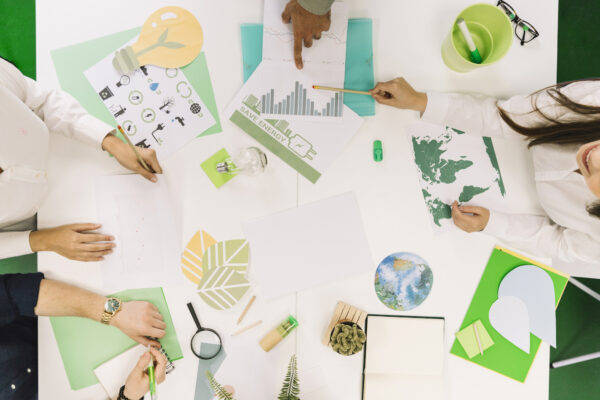 businesspeople-working-on-graph-with-various-natural-resources-icon-on-desk-3 businesspeople-working-on-graph-with-various-natural-resources-icon-on-desk-3